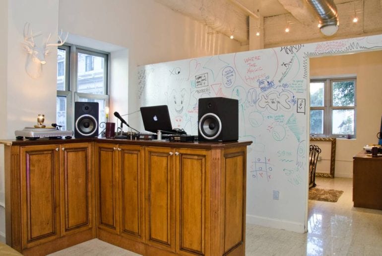 This space features dry erase walls and a music mixing studio!