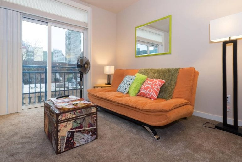 Seattle Comic Con A unique coffee table with a comfortable, plush orange couch