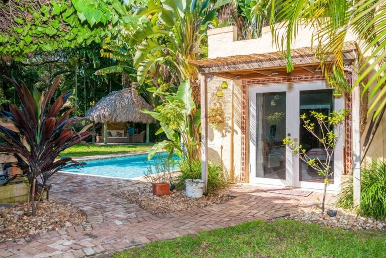 Charming poolside cottage surrounded by palm trees. Miami on the cheap.