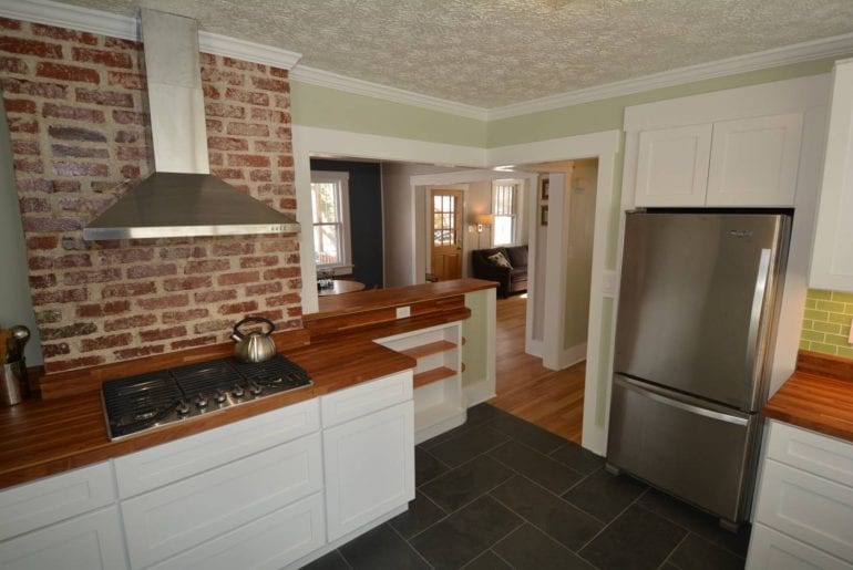 Exposed brick in the spacious kitchen