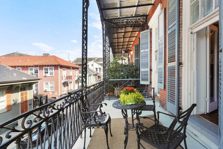 Airbnb New Orleans French Quarter Balcony seating with ample space for outdoor dining, or spectating the activities on Bourbon St.