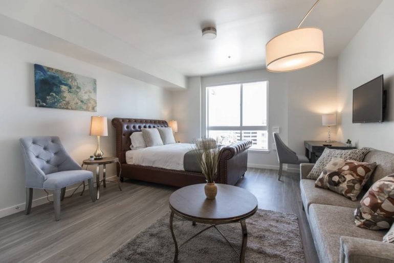 This studio apartment has amazing views of Downtown LA and features a lot of stylish decor 