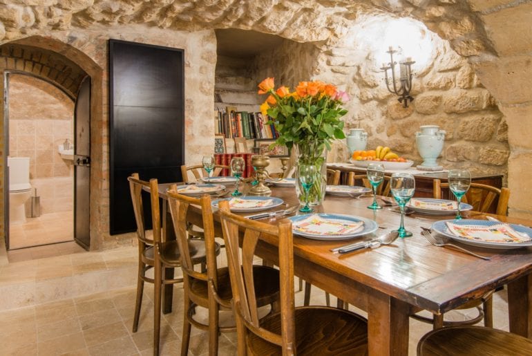 Medieval style kitchen with stone walls and rounded doorways