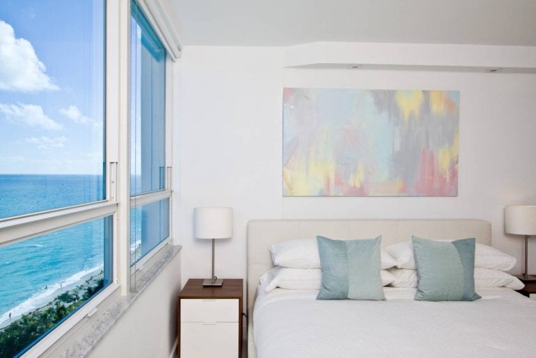 This modern style condo has 180 degree views of Miami Beach. Miami on the cheap.
