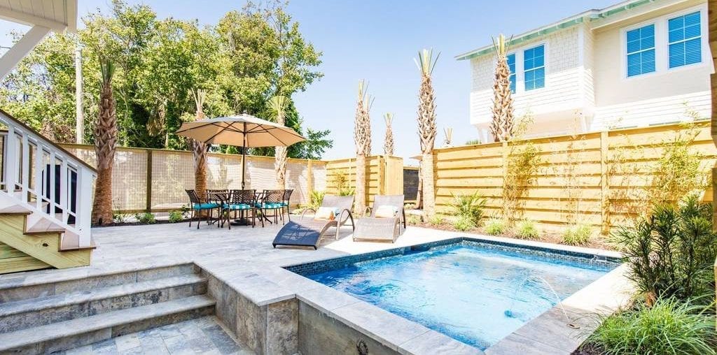 Beautiful patio with an in-ground pool at one of the Folly Beach vacation rentals
