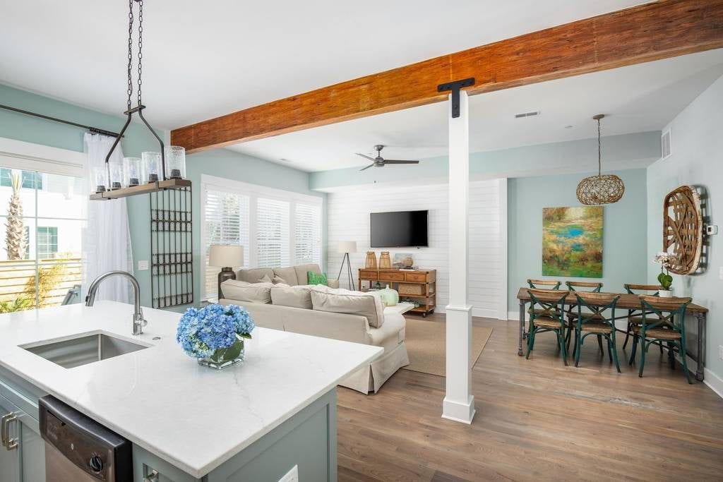 Exposed beams and bright colors elevate the shack vibes at one of the best Folly Beach vacation rentals