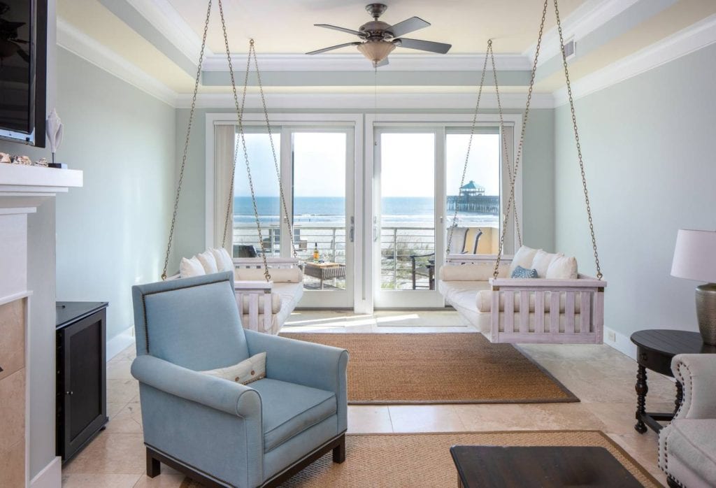 Folly Beach hotels have nothing on this chic condo living room with swinging  couches and panoramic ocean views