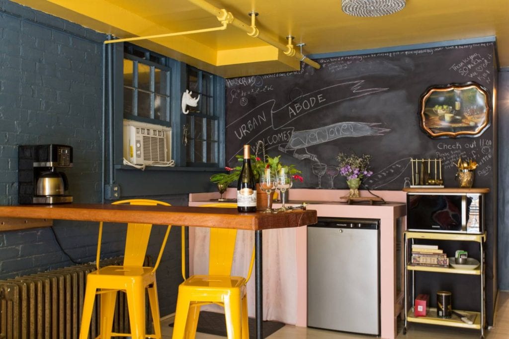 Funky and brightly colored apartment featuring a chalkboard wall