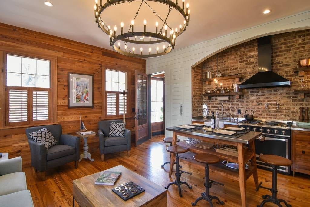 Reclaimed wood and exposed brick highlight the historical, colonial charm of this apartment