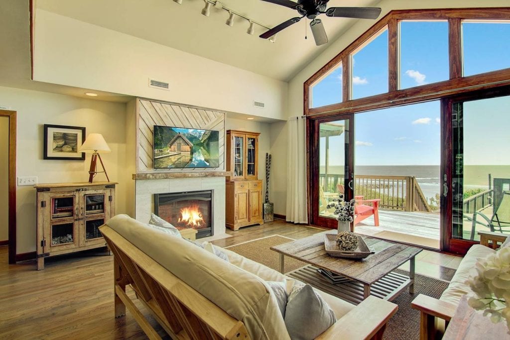 Floor to ceiling windows give this living room a beautiful view of the ocean