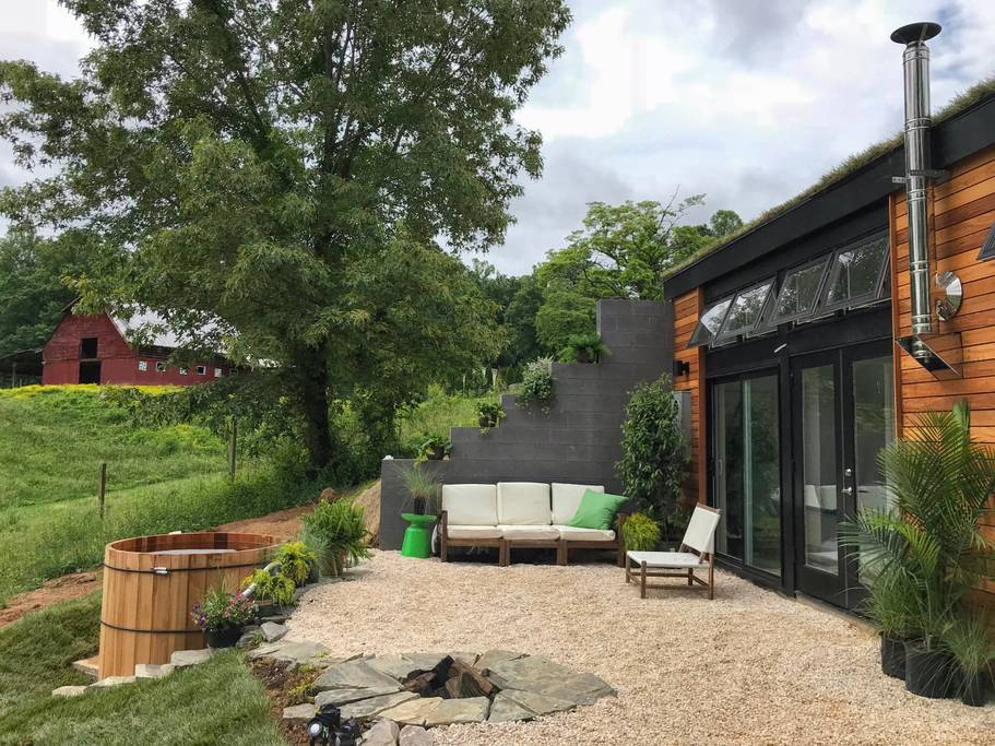Gravel patio of this underground home is one of the best airbnbs in Asheville