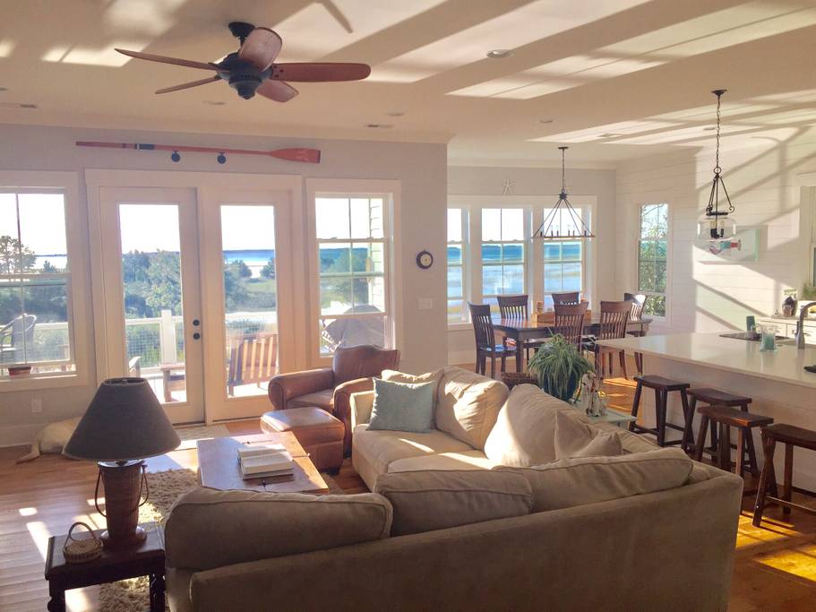 Living and dining room of this Charleston Airbnb near beaches overlook Mount Pleasant sound