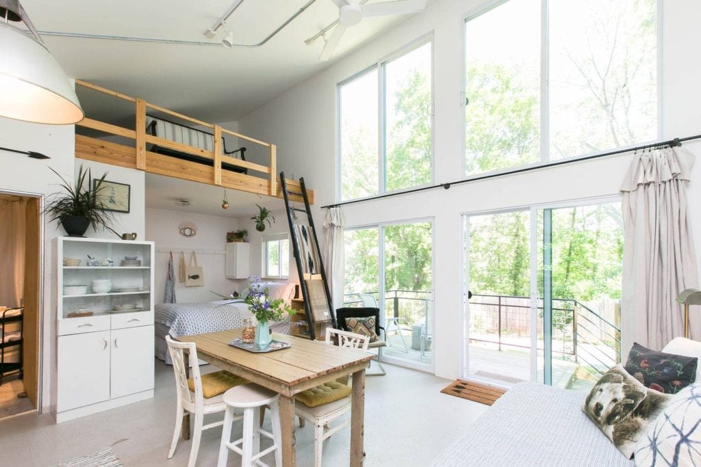 Bright and sunny modern cottage with floor to ceiling windows