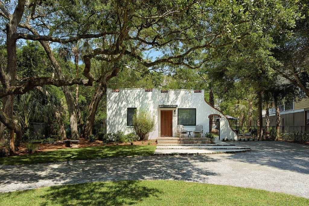 Cottage shaded by large oak trees is a great alternative to Folly Beach hotels