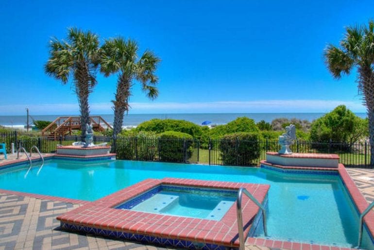 a gorgeous view of the pool in sunshine