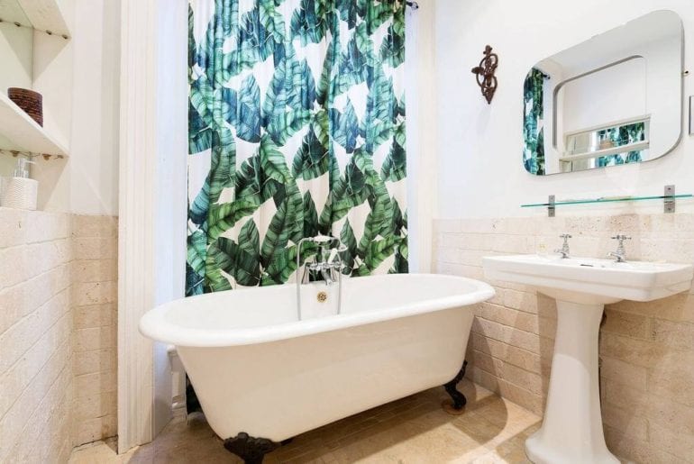 a stand alone bath tub in a kid friendly Airbnb