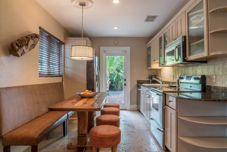 a kitchen space with dining area in an Airbnb vacation rental property in Florida