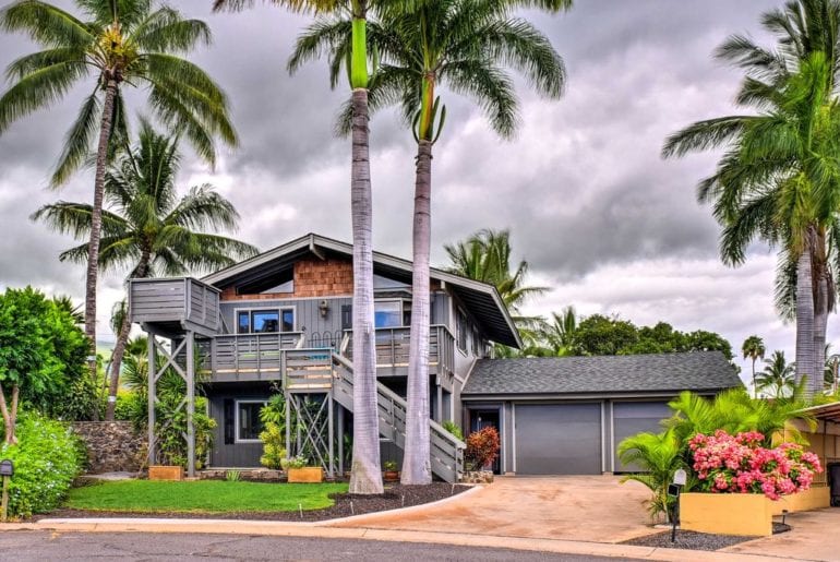 a gorgeous maui vrbo home with palm trees