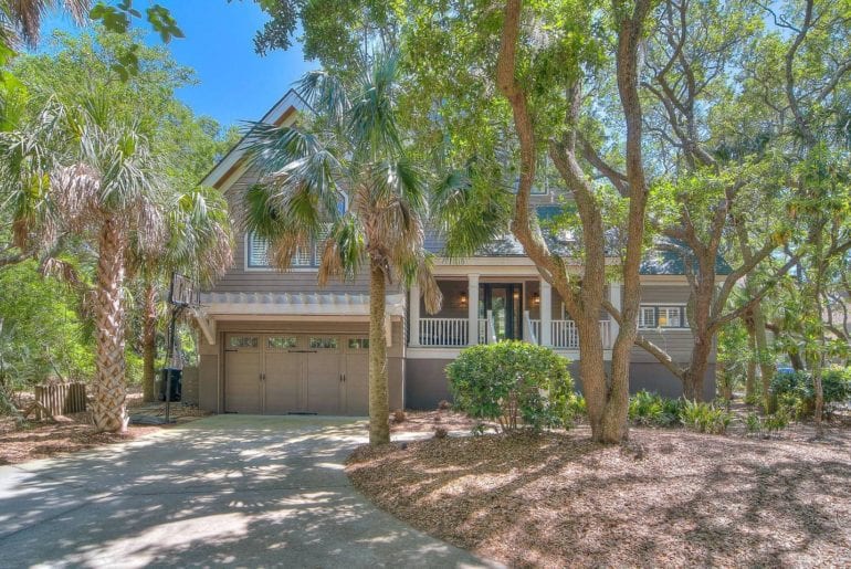 coastal home in South Carolina with palm trees and beach access