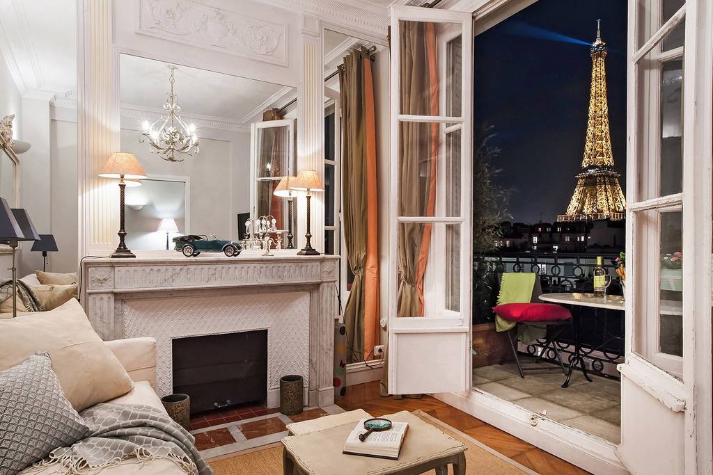 the Eiffel tower at night from a romantic Paris Airbnb