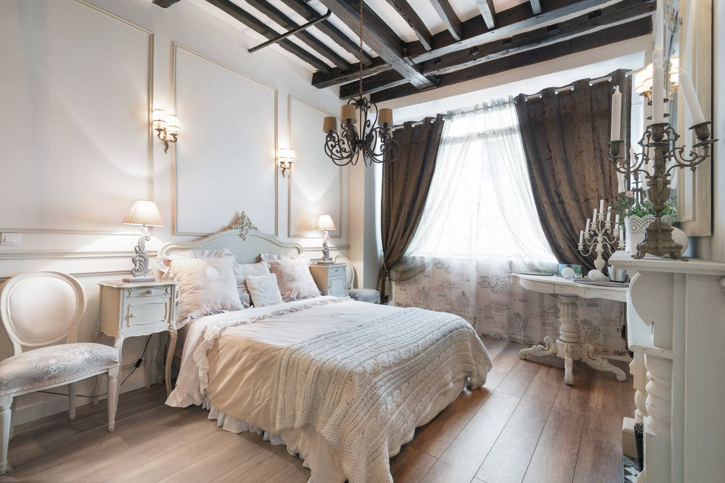 a bedroom with wood beams, perfect for romance