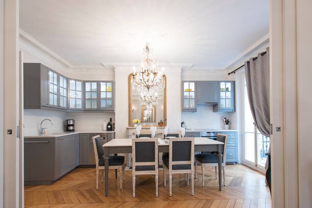 a chandelier and dining area in Paris