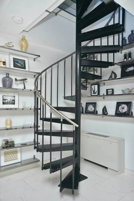 manhattan airbnb apartment with spiral staircase and jacuzzi tub