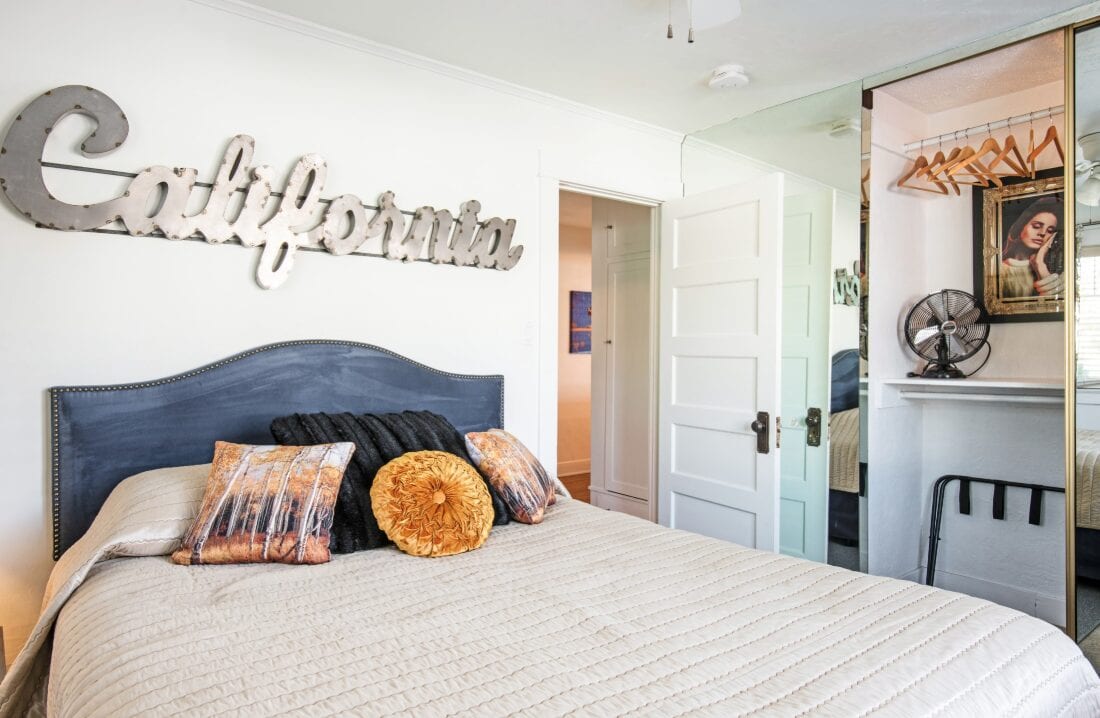 bedroom with california sign over the bed