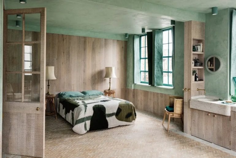 Wood panelled bedroom with lime green walls and ceiling