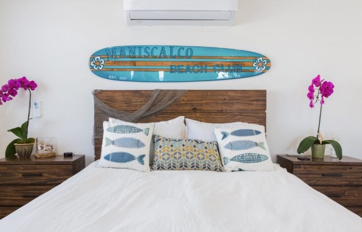 bedroom with surfboard above the headboard in Los Angeles