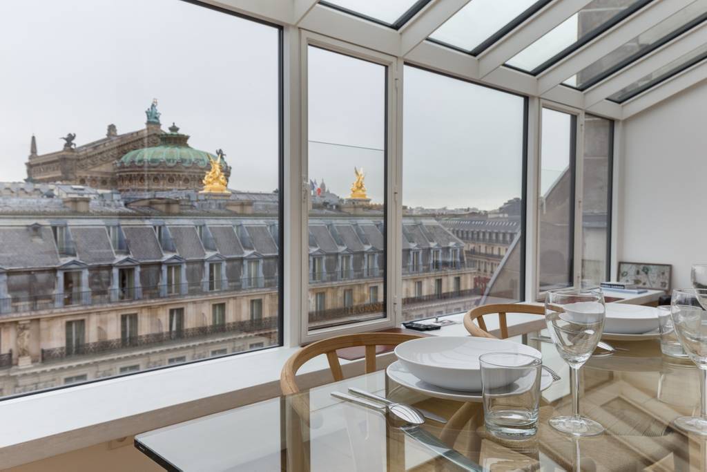 A romantic paris Airbnb with a view of a palace