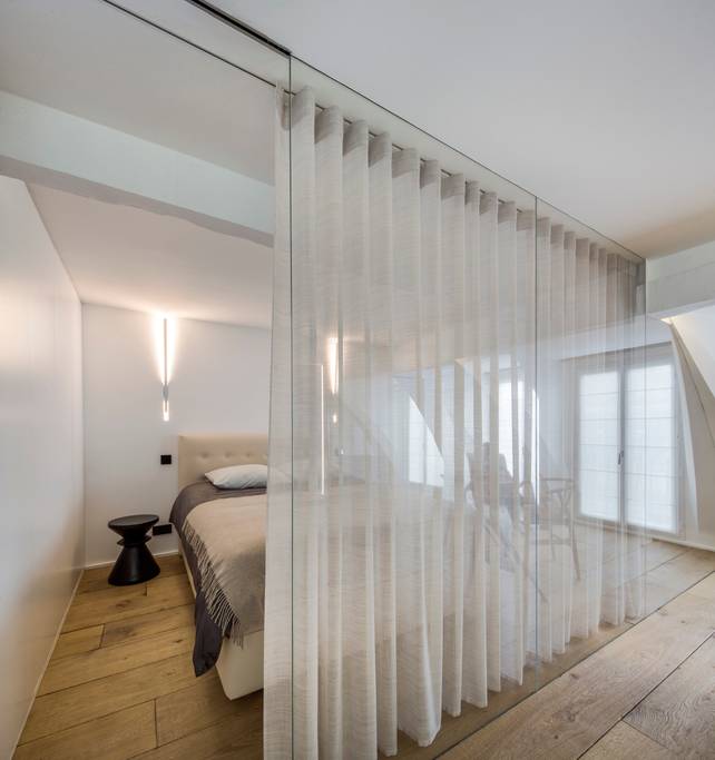 a sheer curtain in the bedroom