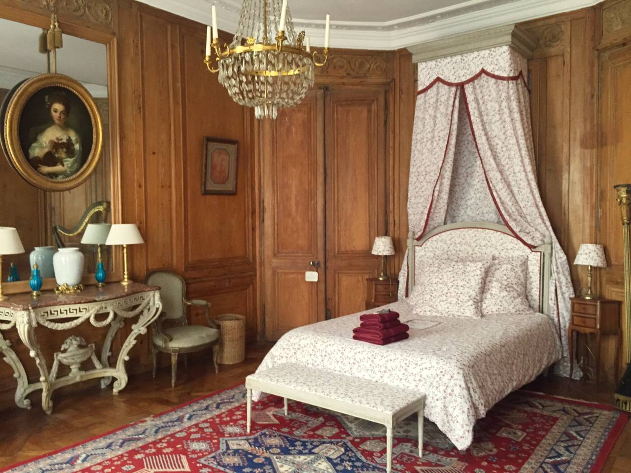 bedroom with chandelier in Paris