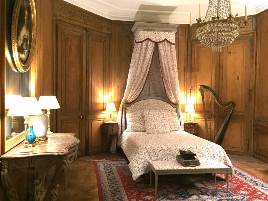 wood panelled bedroom in paris