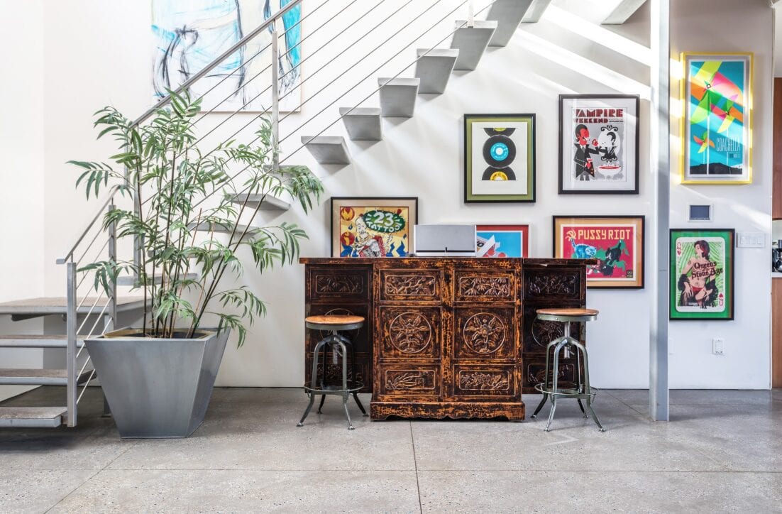 living area with plants and posters in Los Angeles