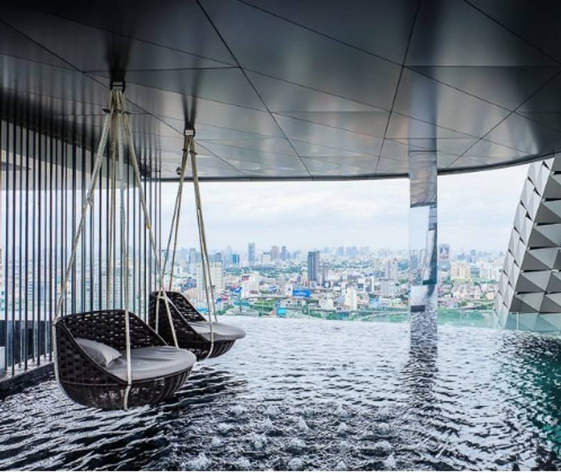 pool apartment with swing chairs in bangkok