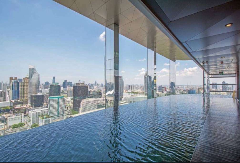 pool apartment with swing chairs in bangkok