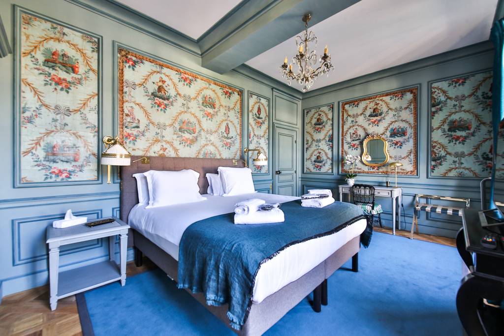 intricate panelling in the bedroom of a Paris home