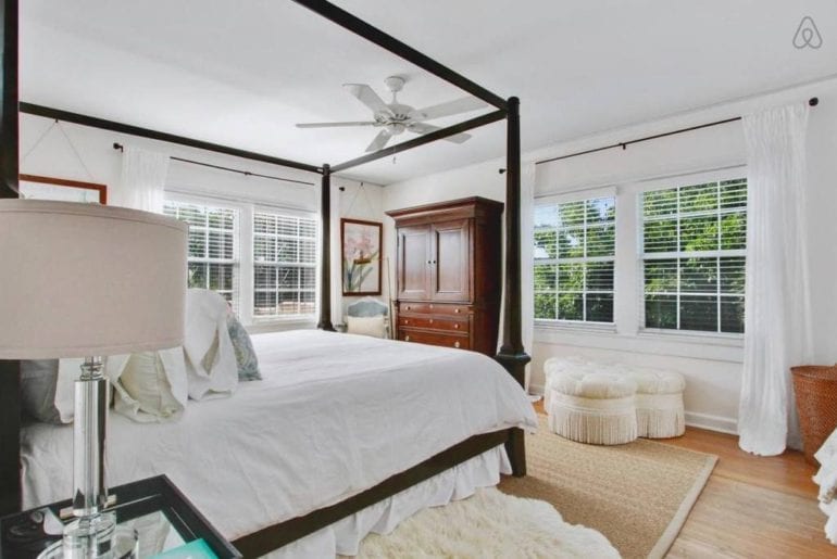 a bedroom with a chest of drawers at the back of the room in West Palm Beach