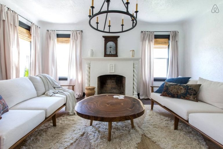 a wooden coffee table and some sodas in the living area of a vacation rental property in Florida