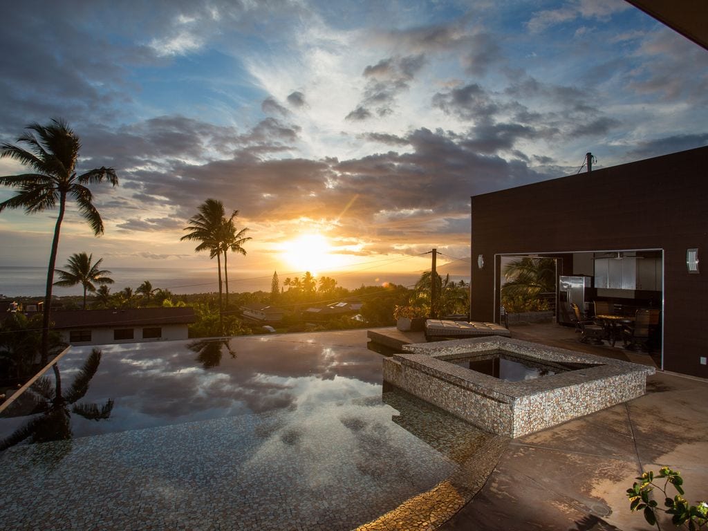 a sunset over the pool in Maui