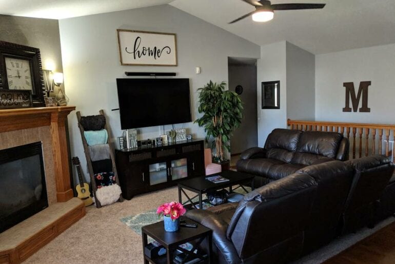 Spacious living room with fireplace and flat screen TV